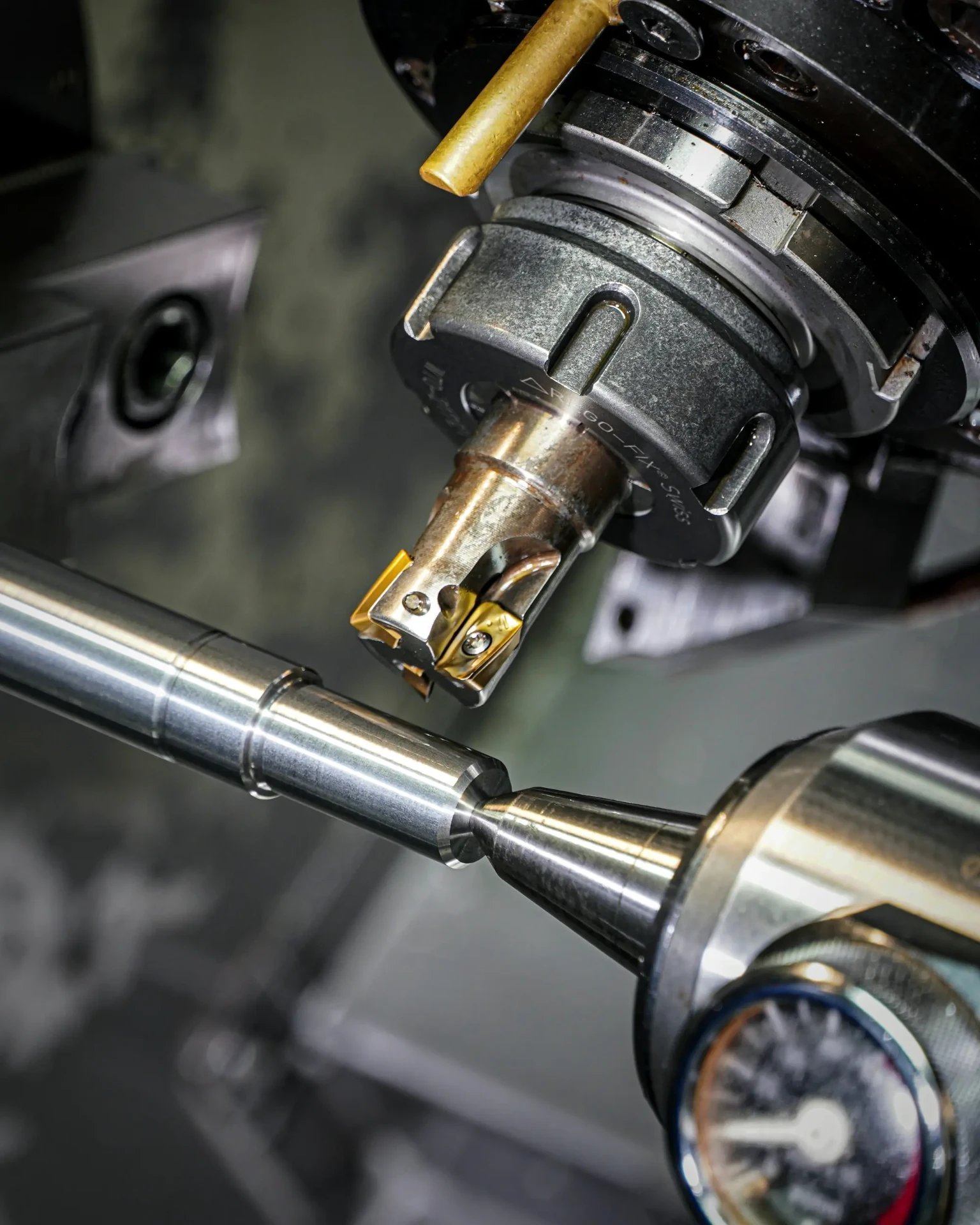 Precision machining tool cutting a metal component in a manufacturing facility
